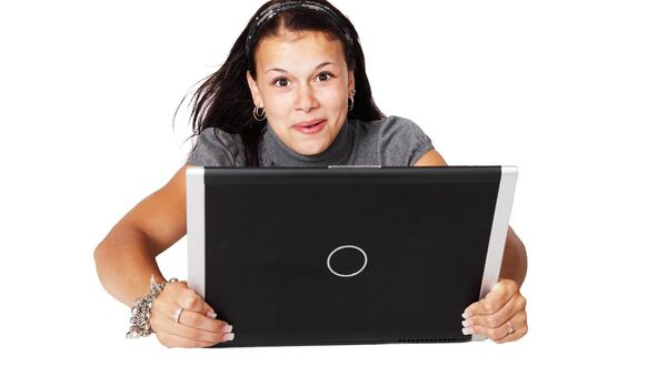Woman holding a laptop - Sputnik International