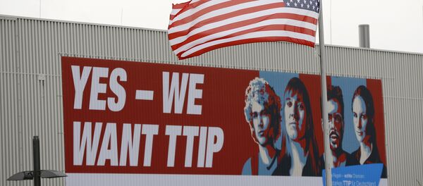 The flag of the USA flutters over a hall of the Hanover Fair decorated with a banner supporting the free trade agreement TTIP (Transatlantic Trade and Investment Partnership) in Hanover, Germany April 25, 2016 The flag of the USA flutters over a hall of the Hanover Fair decorated with a banner supporting the free trade agreement TTIP (Transatlantic Trade and Investment Partnership) in Hanover, Germany April 25, 2016 - Sputnik International