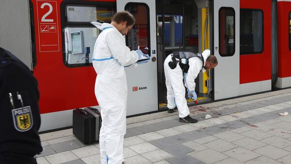 Police investigate the scene of a stabbing at a station in Grafing near Munich, Germany, Tuesday, May 10, 2016 - Sputnik International
