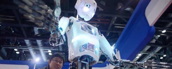 China-science-computer-robot, by Ben DOOLEY This picture taken on November 24, 2015 shows visitors watching a robot (C) demonstration during the World Robot Conference in Beijing China-science-computer-robot, by Ben DOOLEY This picture taken on November 24, 2015 shows visitors watching a robot (C) demonstration during the World Robot Conference in Beijing - Sputnik International