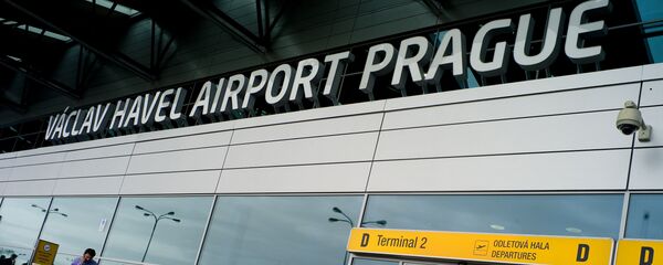 A woman leaves the Vaclav Havel airport in the Czech capital Prague on October 5, 2012 - Sputnik International
