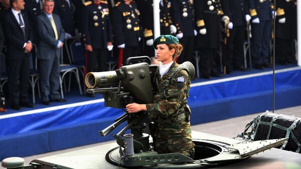 A Greek army female soldier parades in Thessaloniki on October 28, 2013, during the military parade marking Greece's National 'Oxi ' (No) Day, commemorating Greece's refusal to surrender to Benito Mussolini's Italy in 1940 during World War II - Sputnik International
