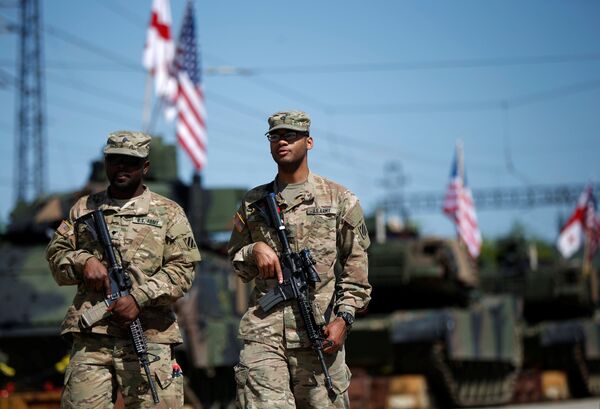 U.S. servicemen walk past U.S. M1A2 Abrams tanks as they arrive for the joint U.S.-Georgian exercise Noble Partner 2016 in Vaziani, Georgia, May 5, 2016 U.S. servicemen walk past U.S. M1A2 Abrams tanks as they arrive for the joint U.S.-Georgian exercise Noble Partner 2016 in Vaziani, Georgia, May 5, 2016 - Sputnik International