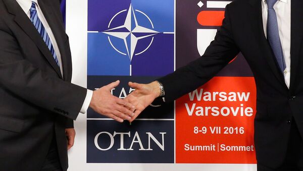 Logo for the upcoming NATO Warsaw summit 2016 - Sputnik International