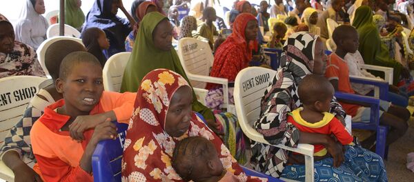 In this Feb. 12, 2016, file photo, woman and children detained by Nigeria army who have no links to Boko Haram sit under a canopy before their release at the Giwa military barracks in Maiduguri, Nigeria. In this Feb. 12, 2016, file photo, woman and children detained by Nigeria army who have no links to Boko Haram sit under a canopy before their release at the Giwa military barracks in Maiduguri, Nigeria. - Sputnik International