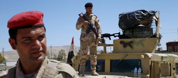 Iraqi soldiers guard their base in Makhmour, after it was freed from control of Islamic State, south of Mosul, April 17, 2016 Iraqi soldiers guard their base in Makhmour, after it was freed from control of Islamic State, south of Mosul, April 17, 2016 - Sputnik International