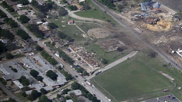 This April 18, 2013, file aerial photo shows the remains of a nursing home, left, apartment complex, center, and a fertilizer plant, right, destroyed by an explosion in West, Texas - Sputnik International
