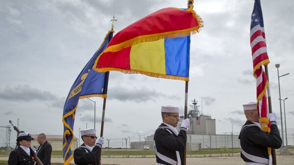 US Navy flag bearers, backdropped by the radar building of a missile defense base, walk in Deveselu, during an opening ceremony attended by U.S., NATO and Romanian officials at a base, originally established by the Soviet Union, in Deveselu, Southern Romania, Thursday, May 12, 2016. - Sputnik International