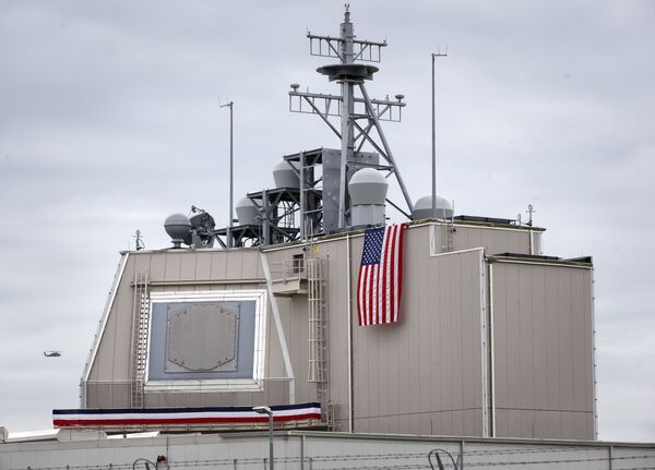 A helicopter flies by the radar building of a missile defense base, in Deveselu, prior to an opening ceremony attended by U.S., NATO and Romanian officials at a base, originally established by the Soviet Union, in Deveselu, Southern Romania, Thursday, May 12, 2016. A helicopter flies by the radar building of a missile defense base, in Deveselu, prior to an opening ceremony attended by U.S., NATO and Romanian officials at a base, originally established by the Soviet Union, in Deveselu, Southern Romania, Thursday, May 12, 2016. - Sputnik International