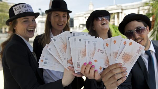 Demonstrators dressed as businessmen protests against tax avoidance at a tropical 'tax' haven in central London on May 12, 2016, near the venue of the Anti-Corruption Summit London 2016. - Sputnik International