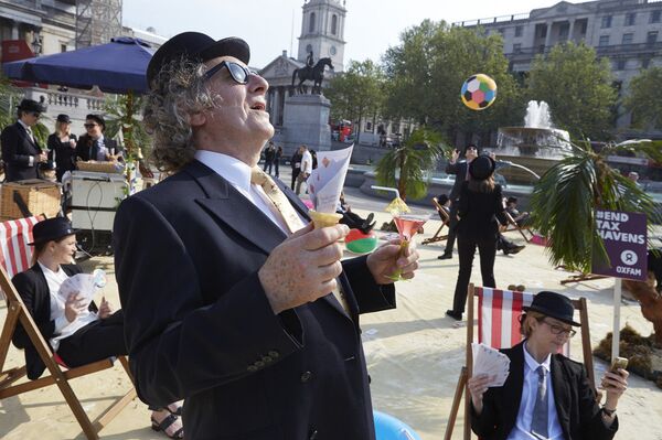 London's Trafalgar Square transformed into an interactive, tropical tax haven by Oxfam, Action Aid and Christian Aid. London's Trafalgar Square transformed into an interactive, tropical tax haven by Oxfam, Action Aid and Christian Aid. - Sputnik International