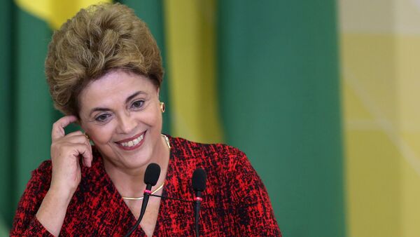 Brazil's President Dilma Rousseff smiles as she attends a signing ceremony for new universities at Planalto Palace in Brasilia, Brazil - Sputnik International
