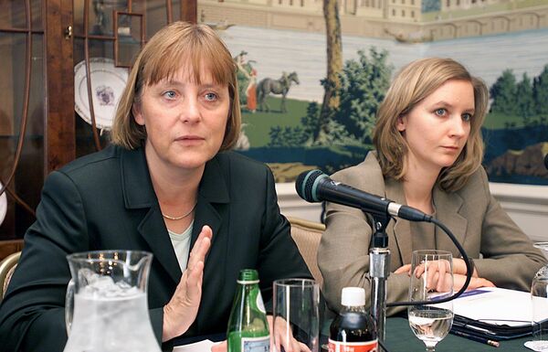 Angela Merkel (L), then German opposition party leader (of the Conservative Christian Democratic Union), addresses reporters 26 April, 2001. Angela Merkel (L), then German opposition party leader (of the Conservative Christian Democratic Union), addresses reporters 26 April, 2001. - Sputnik International