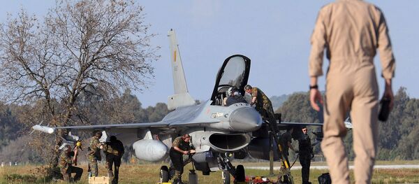 A Belgian pilot walks toward his F-16 fighter jet at Araxos airport in Kato Ahaia, Greece. A Belgian pilot walks toward his F-16 fighter jet at Araxos airport in Kato Ahaia, Greece. - Sputnik International
