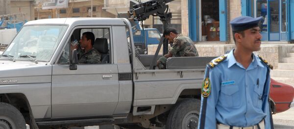 Yemeni policemen stand guard in the Yemeni city of Mukalla - Sputnik International