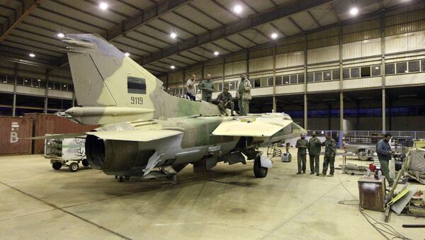 Engineers from the Libyan air force repair a MIG-23bn fighter jet at a military air base in the eastern coastal city of Benghazi on May 2, 2016 - Sputnik International