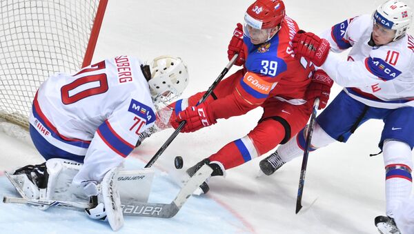 The Norwegian team's goalkeeper Steffen Soberg, Russia's player Stepan Sannikov and Norway's player Mattias Norstebo seen in the World Ice Hockey Championship's match between Russia and Norway - Sputnik International