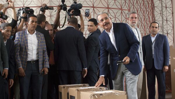 Danilo Medina, current president and presidential candidate for the Dominican Liberation Party, casts his ballot during the general elections, in Santo Domingo, Dominican Republic, Sunday, May 15, 2016 - Sputnik International