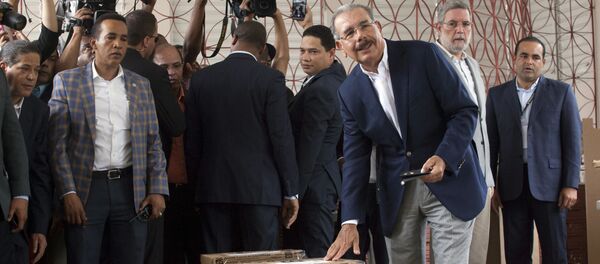 Danilo Medina, current president and presidential candidate for the Dominican Liberation Party, casts his ballot during the general elections, in Santo Domingo, Dominican Republic, Sunday, May 15, 2016 Danilo Medina, current president and presidential candidate for the Dominican Liberation Party, casts his ballot during the general elections, in Santo Domingo, Dominican Republic, Sunday, May 15, 2016 - Sputnik International