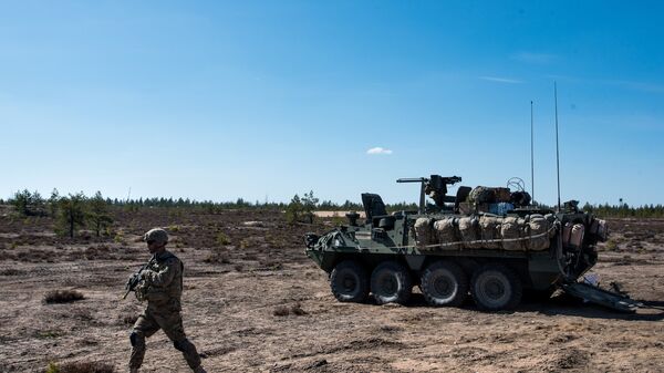 US army soldier and Stryker armored vehicle during Arrow 16 mechanised exercise of the Finnish Army in collaboration with US Army Europe's 2nd Cavalry Regiment's Mechanized Infantry Company in Niinisalo, Finland (File) - Sputnik International