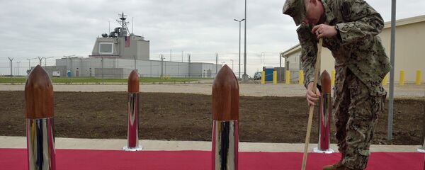 US Army personnel cleans the red carpet ahead an inauguration ceremony of the US anti-missile station Aegis Ashore Romania (in the background) at the military base in Deveselu, Romania on May 12, 2016 US Army personnel cleans the red carpet ahead an inauguration ceremony of the US anti-missile station Aegis Ashore Romania (in the background) at the military base in Deveselu, Romania on May 12, 2016 - Sputnik International