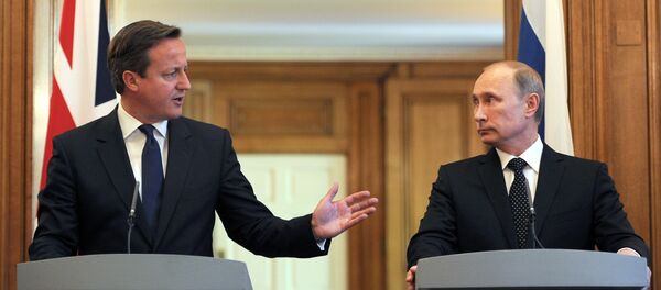 British Prime Minister David Cameron (L) speaks during a press conference with Russian President Vladimir Putin following a meeting inside10 Downing Street, central London, on June 16, 2013. British Prime Minister David Cameron (L) speaks during a press conference with Russian President Vladimir Putin following a meeting inside10 Downing Street, central London, on June 16, 2013. - Sputnik International