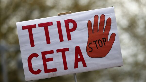 A placard against Comprehensive Economic and Trade Agreement (CETA) and Transatlantic Trade and Investment Partnership (TTIP) agreements. - Sputnik International