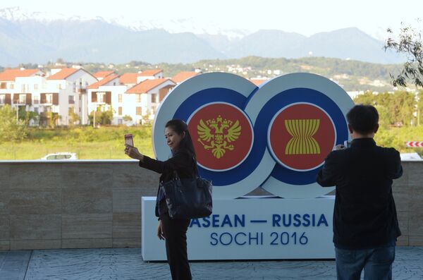 Holidaymakers take pictures with the ASEAN-Russia Summit logo near the Sochi Congress Center, which will be a venue of the ASEAN-Russia Summit Holidaymakers take pictures with the ASEAN-Russia Summit logo near the Sochi Congress Center, which will be a venue of the ASEAN-Russia Summit - Sputnik International