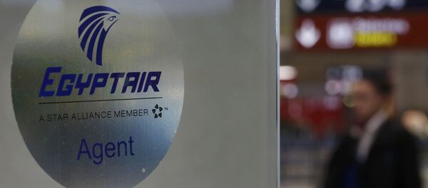 A man passes the Egyptair desk at Charles de Gaulle airport, after an Egyptair flight disappeared from radar during its flight from Paris to Cairo, in Paris, France, May 19, 2016 - Sputnik International
