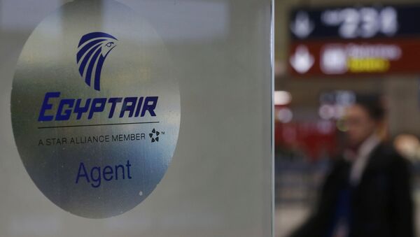 A man passes the Egyptair desk at Charles de Gaulle airport, after an Egyptair flight disappeared from radar during its flight from Paris to Cairo, in Paris, France, May 19, 2016 - Sputnik International
