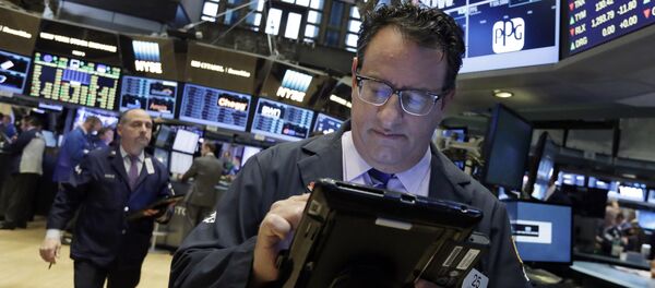 Trader Peter Costa, right, works on the floor of the New York Stock Exchange, Wednesday, May 4, 2016 Trader Peter Costa, right, works on the floor of the New York Stock Exchange, Wednesday, May 4, 2016 - Sputnik International