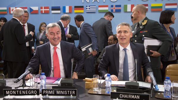 NATO Secretary General Jens Stoltenberg, right, and Montenegro's Prime Minister Milo Dukanovic, left, take their seats during a meeting of the North Atlantic Council and Montenegro at NATO headquarters in Brussels on Thursday, May 19, 2016 - Sputnik International
