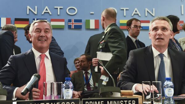 Montenegro's Prime Minister Milo Dukanovic (L) attends a NATO Foreign minister meeting next to NATO Secretary General Jens Stoltenberg (R) at the NATO headquarters in Brussels on May 19, 2016 - Sputnik International