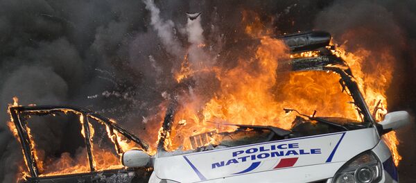 A police car explodes after being set on fire during an unauthorized counter-demonstration against police violence on May 18, 2016 in Paris, as Police across France demonstrate today against the anti-cop hatred they say they have endured during a wave of anti-government protests since early March A police car explodes after being set on fire during an unauthorized counter-demonstration against police violence on May 18, 2016 in Paris, as Police across France demonstrate today against the anti-cop hatred they say they have endured during a wave of anti-government protests since early March - Sputnik International