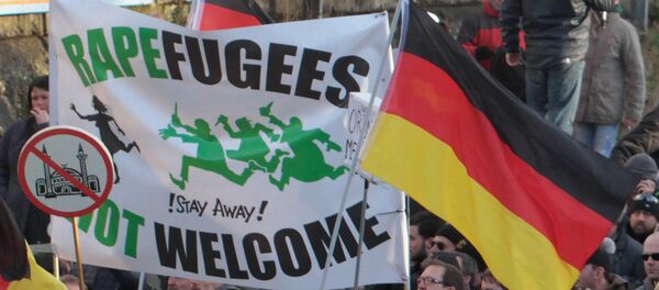 Right-wing demonstrators hold a sign Rapefugees not welcome - !Stay away! and a sign with a crossed out mosque as they march in Cologne, Germany Right-wing demonstrators hold a sign Rapefugees not welcome - !Stay away! and a sign with a crossed out mosque as they march in Cologne, Germany - Sputnik International