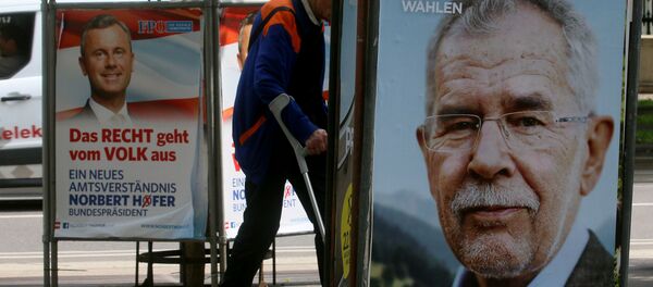 A man walks between election posters of Alexander Van der Bellen, candidate for presidential elections and former head of the Austrian Greens, right, and Norbert Hofer, candidate for presidential elections of Austria's right-wing Freedom Party, FPOE, left, in Vienna, Austria - Sputnik International