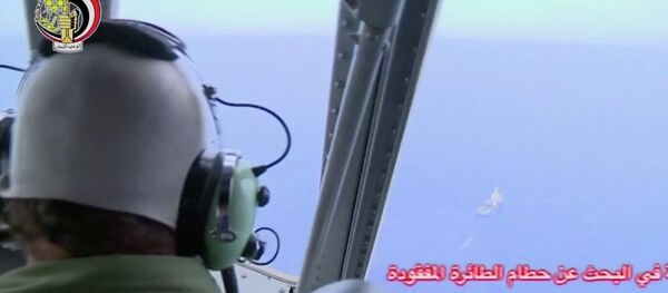 A pilot looks out of the cockpit during a search operation by Egyptian air and navy forces for the EgyptAir plane that disappeared in the Mediterranean Sea, in this still image taken from video May 20, 2016. A pilot looks out of the cockpit during a search operation by Egyptian air and navy forces for the EgyptAir plane that disappeared in the Mediterranean Sea, in this still image taken from video May 20, 2016. - Sputnik International