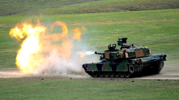 A US M1A2 Abrams tank fires during the Noble Partner 2016 joint military exercise at the Vaziani training area outside Tbilisi on May 18, 2016. - Sputnik International