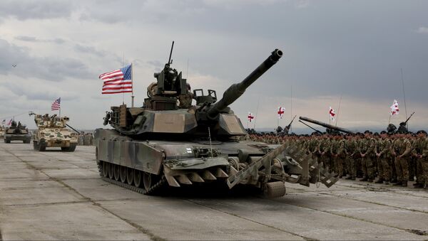 U.S servicemen drive their armored vehicles at the opening ceremony of U.S, British and Georgian troops joint military exercises at the Vaziani military base outside Tbilisi, Georgia, Wednesday, May 11, 2016. - Sputnik International