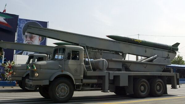 Iranian Nazeat 10 ground-to-air missile is displayed during the army day military parade, outside the mausoleum of the late founder of Islamic republic, Ayatollah Khomeini (poster) in Tehran. (File) - Sputnik International
