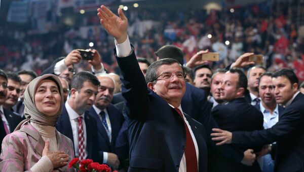 Head of the governing Justice and Development Party and Prime Minister Ahmet Davutoglu with his wife Sare Davutoglu, left, waves towards supporters during the party congress in Ankara, Turkey, Sunday, May 22, 2016. - Sputnik International