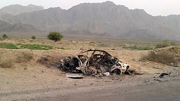 This photo taken by a freelance photographer Abdul Salam Khan using his smart phone on Sunday, May 22, 2016, purports to show the destroyed vehicle in which Mullah Mohammad Akhtar Mansour was traveling in the Ahmad Wal area in Baluchistan province of Pakistan, near Afghanistan's border. - Sputnik International
