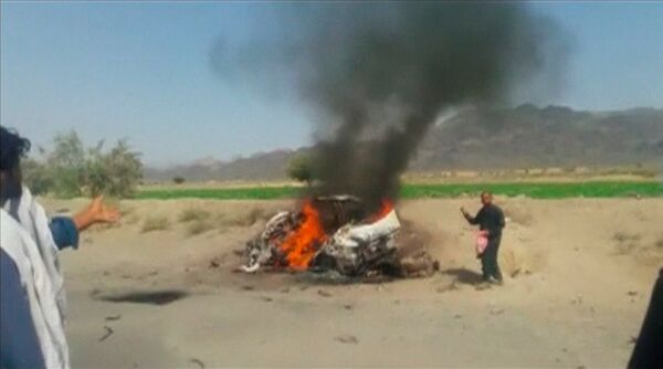 A car is seen on fire at the site of a drone strike believed to have killed Afghan Taliban leader Mullah Akhtar in southwest Pakistan in this still image taken from video, May 21, 2016. A car is seen on fire at the site of a drone strike believed to have killed Afghan Taliban leader Mullah Akhtar in southwest Pakistan in this still image taken from video, May 21, 2016. - Sputnik International