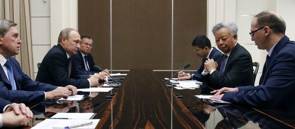 Russian President Vladimir Putin (2nd L) meets with Asian Infrastructure Investment Bank President Jin Liqun (2nd R) at the Bocharov Ruchei state residence in Sochi on May 18, 2016. Russian President Vladimir Putin (2nd L) meets with Asian Infrastructure Investment Bank President Jin Liqun (2nd R) at the Bocharov Ruchei state residence in Sochi on May 18, 2016. - Sputnik International