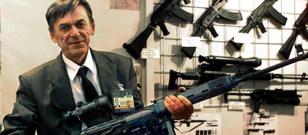 Victor Kalashnikov, the son of Russian Mikhail Kalashnikov, the inventor of the famous assault rifle, shows off a model of his own pistol machinegun, the Bizon-2, which is to equip Russia's police force Victor Kalashnikov, the son of Russian Mikhail Kalashnikov, the inventor of the famous assault rifle, shows off a model of his own pistol machinegun, the Bizon-2, which is to equip Russia's police force - Sputnik International