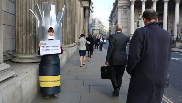 A campaigner dressed as a cluster bomb in London, UK. - Sputnik International