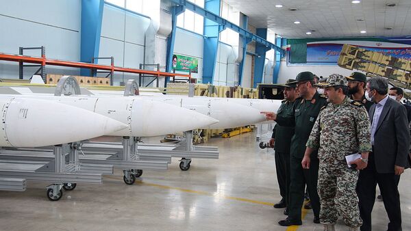 Iran's Defence Minister Hossein Dehqan (2nd L) pointing at an anti-missile system missiles of Sayyad-2 (Hunter 2), during the inauguration of it's production line in Tehran on November 9, 2013 - Sputnik International