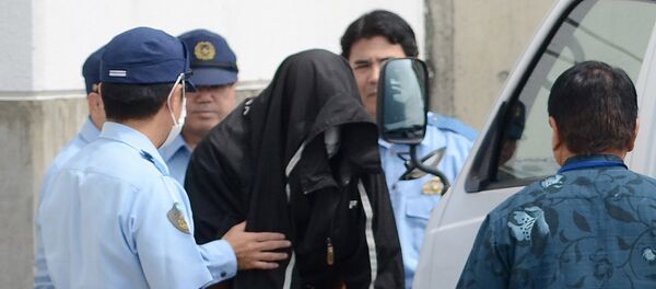 Policemen escort US citizen and former US Marine Kenneth Franklin Shinzato (C) to the prosecutor's office at Uruma Police Station in Uruma, Okinawa prefecture - Sputnik International