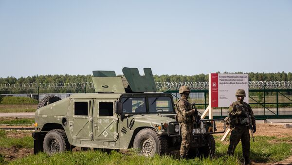 Soldiers stand guard during ground breaking ceremony of the northern section of defence anti-missile shield in Redzikowo military base in northern Poland - Sputnik International