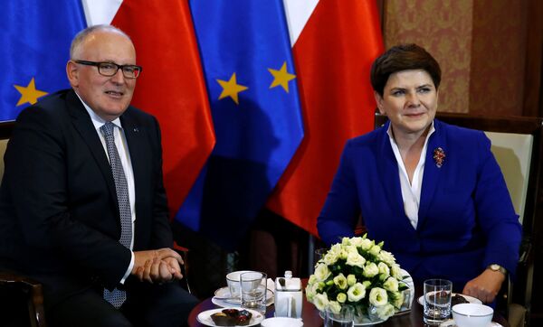 Poland's Prime Minister Beata Szydlo meets with Frans Timmermans, deputy head of the European Commission at the Prime Minister Chancellery in Warsaw, Poland May 24, 2016. Poland's Prime Minister Beata Szydlo meets with Frans Timmermans, deputy head of the European Commission at the Prime Minister Chancellery in Warsaw, Poland May 24, 2016. - Sputnik International